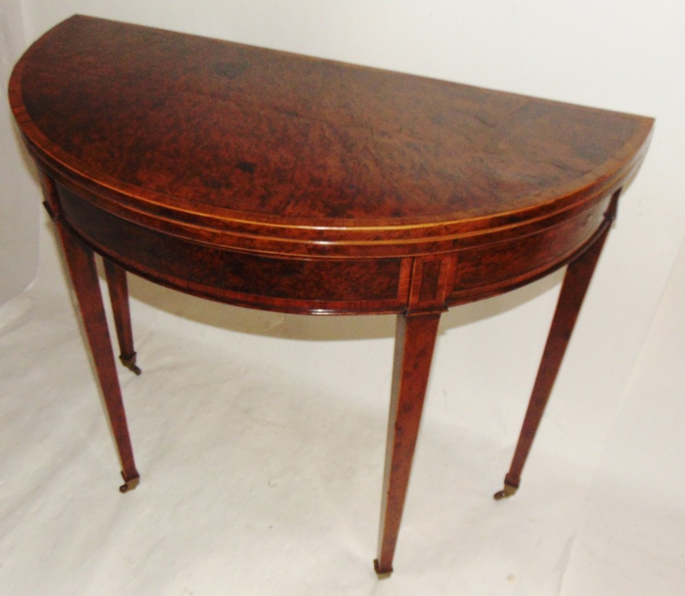 Sheraton burr yew-wood half round card table. Circa 1790