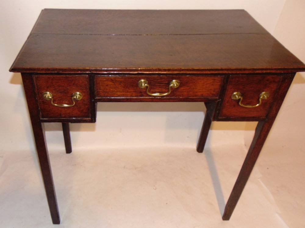 Georgian oak kneehole side table. Circa 1780