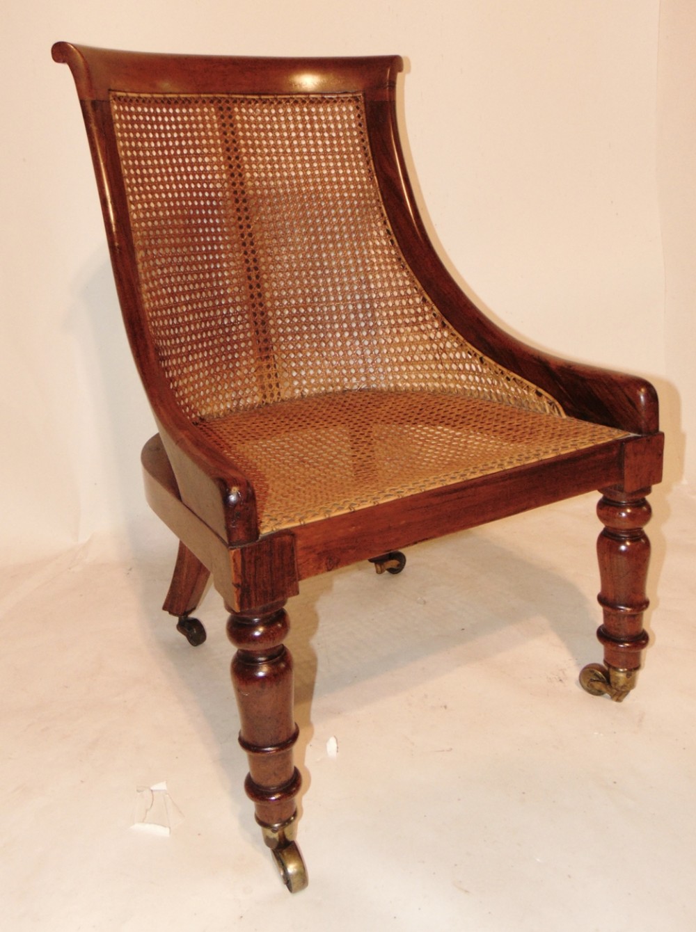Regency rosewood bergere chair. Circa 1830
