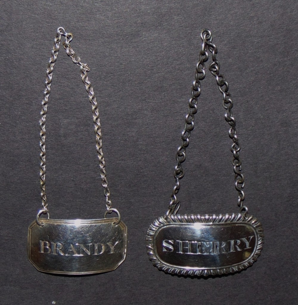 Two Georgian silver wine labels. 1810-21