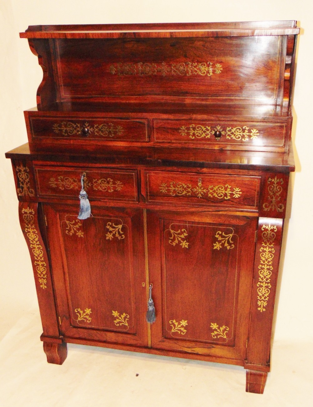 Regency rosewood & brass inlaid side cabinet. Circa 1810
