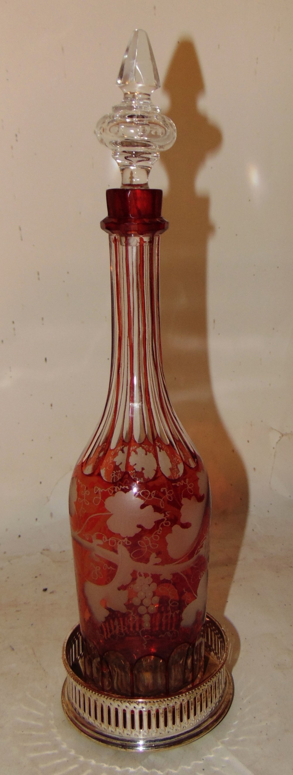 Victorian ruby glass decanter with plated coaster. Circa 1860