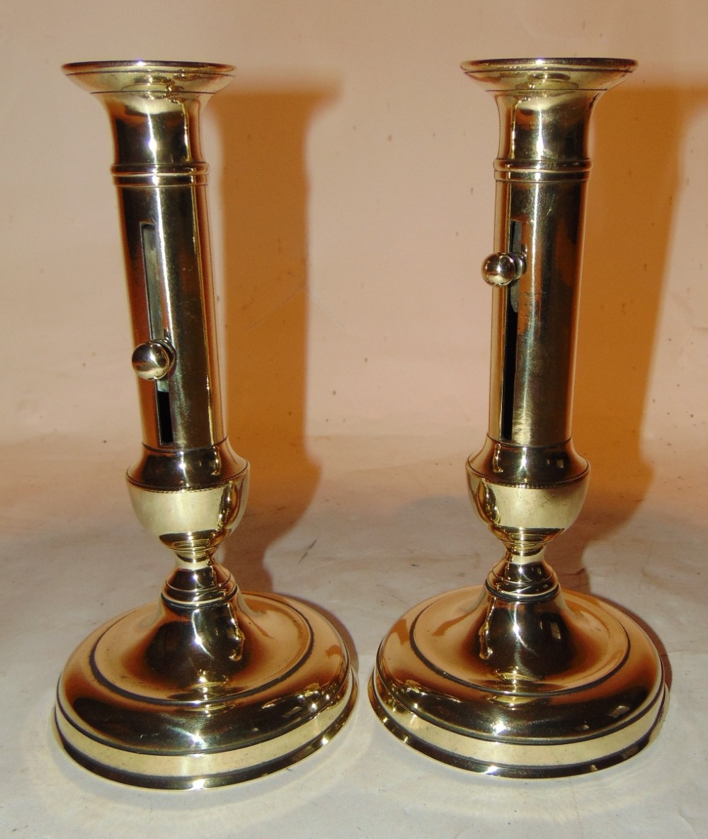 Pair Georgian brass ejector candlesticks. Circa 1820