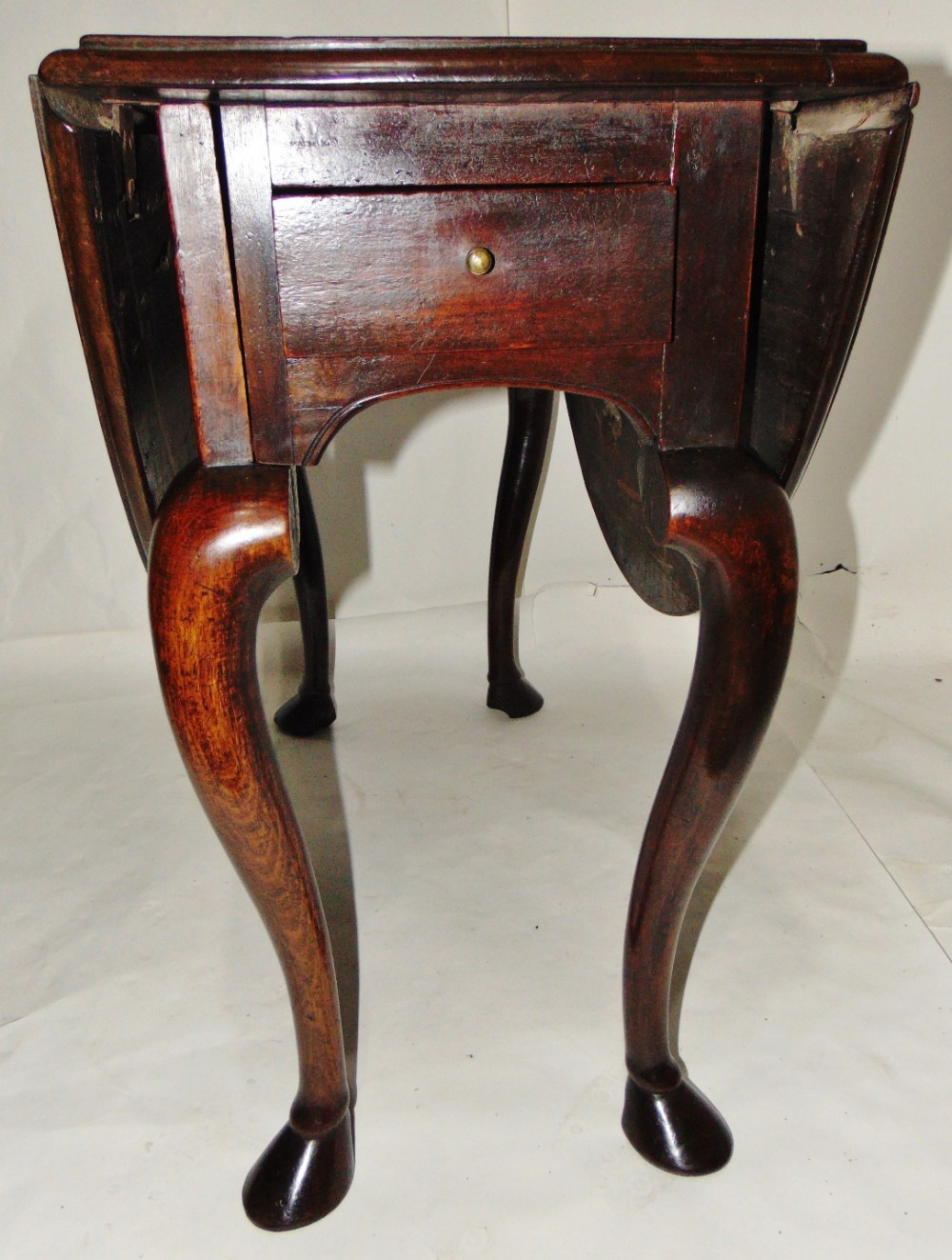 George II walnut cabriole leg dining table. Hoof feet circa 1740