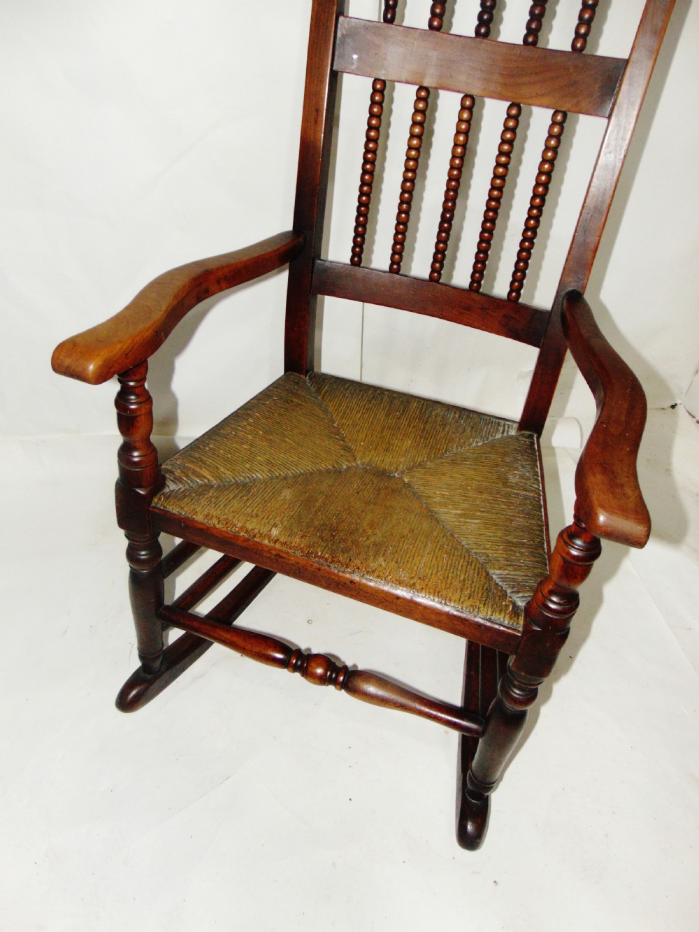 Late Georgian fruitwood rocking chair circa 1830 View III