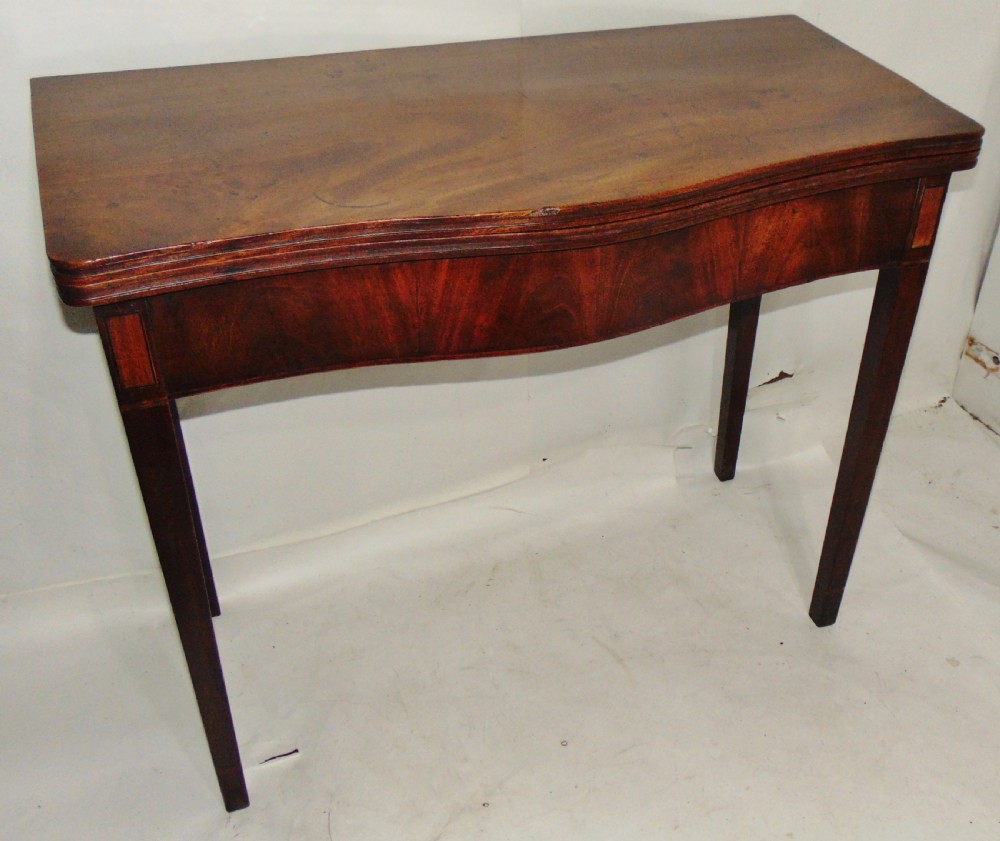 Georgian mahogany serpentine tea table circa 1790 View II