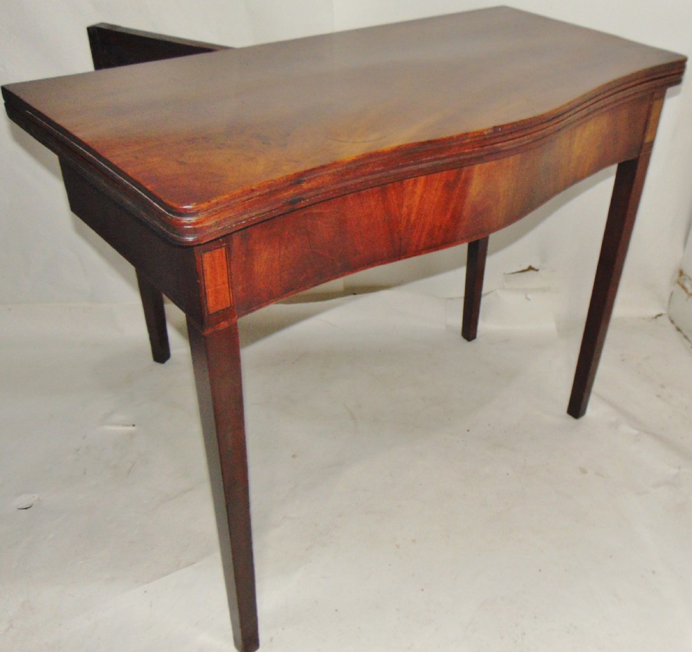 Georgian mahogany serpentine tea table circa 1790 View VII