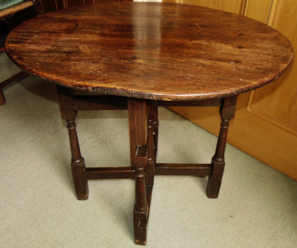 Early oak folding coaching table circa 1710