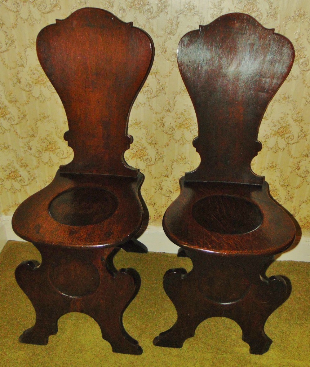Pair George III iak hall chairs circa 1770