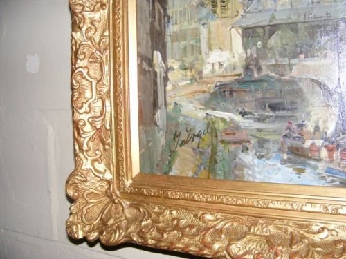 fig 2. An oil painting on canvas depicting a historic European canal cityscape with a church spire, set inside an ornate carved gilt frame.