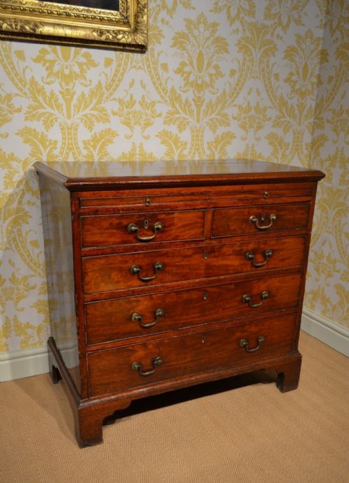 A Fabulous Small Mahogany Georgian Bachelor Chest with a Slide.