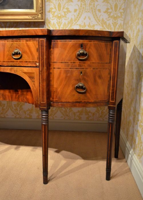 fig 1. A Regency mahogany veneered Breakfront Sideboard.