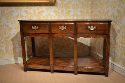 fig 1. Fabulous 18th Century Oak Potboard Dresser Base with three drawers sat above a decorative shaped frieze.