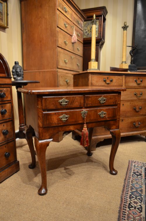 An 18th Century Walnut Lowboy.