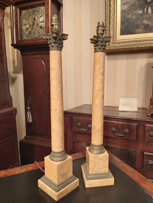 A Pair of Ochre Marble and Cold Cast Bronze Corinthian
column Table Lamps.