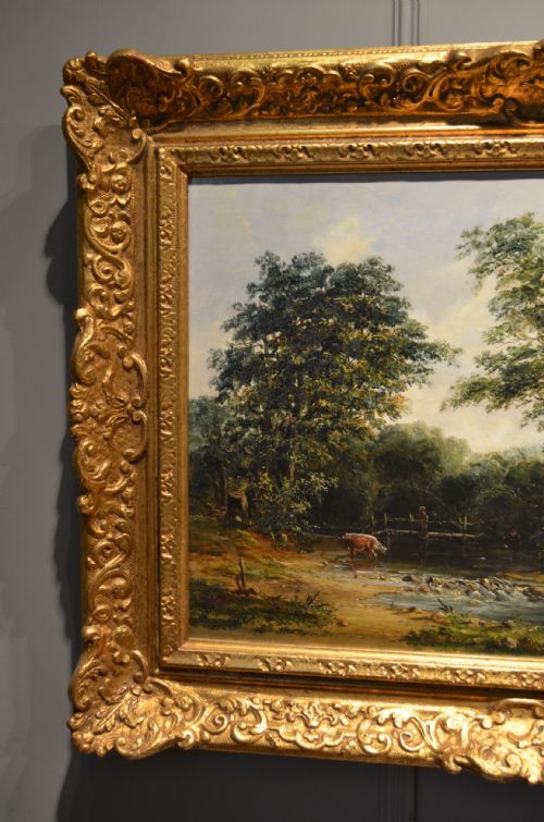 fig 2. A pair of 19th-century oil paintings on canvas depicting peaceful English rural landscapes framed in elaborate gold giltwood frames.