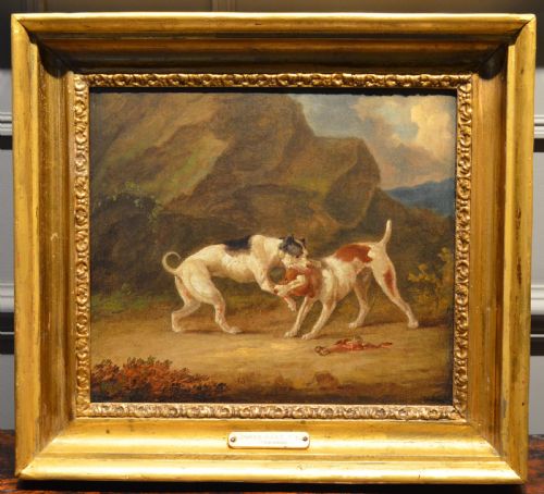 fig 3. An 19th-century oil painting depicting two sporting dogs in an outdoor landscape, enclosed within a heavy carved gilded frame.