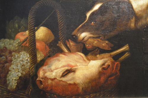 fig 5. An oil painting depicting two dogs reaching into a woven basket containing meat and fruit, encased in an ornate gilded frame.