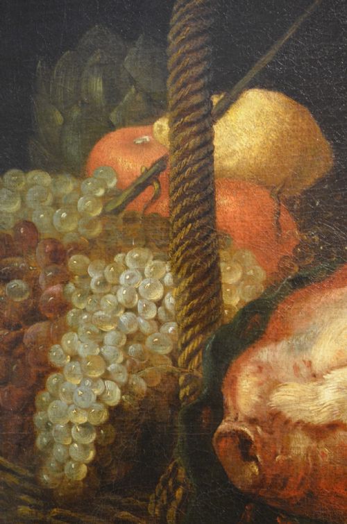fig 6. An oil painting depicting two dogs reaching into a woven basket containing meat and fruit, encased in an ornate gilded frame.