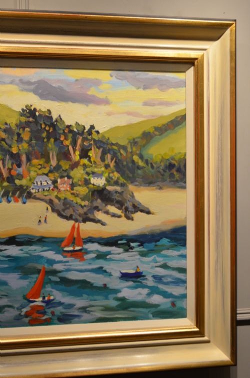 fig 2. A framed oil painting on canvas depicting boats with red sails on blue water before a sandy shore and green hills.
