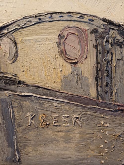 fig 5. An original oil painting on board depicting a dark grey and red side tank steam locomotive sitting on railway tracks, presented in a light wooden frame with a wide mount.