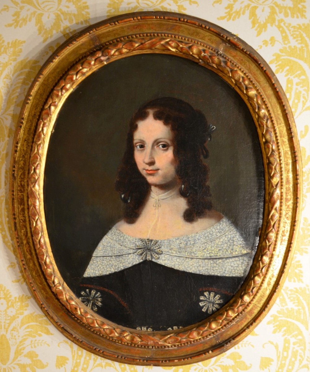 Superb 17th Century painting of a young lady in an oval frame.