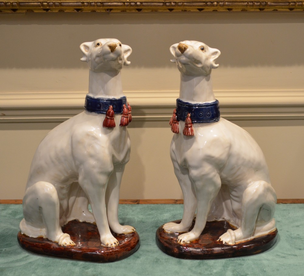 A Stunning Pair of French Faience Dogs.