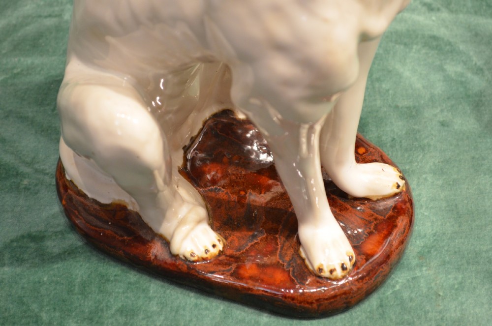 A Stunning Pair of French Faience Dogs. View XI