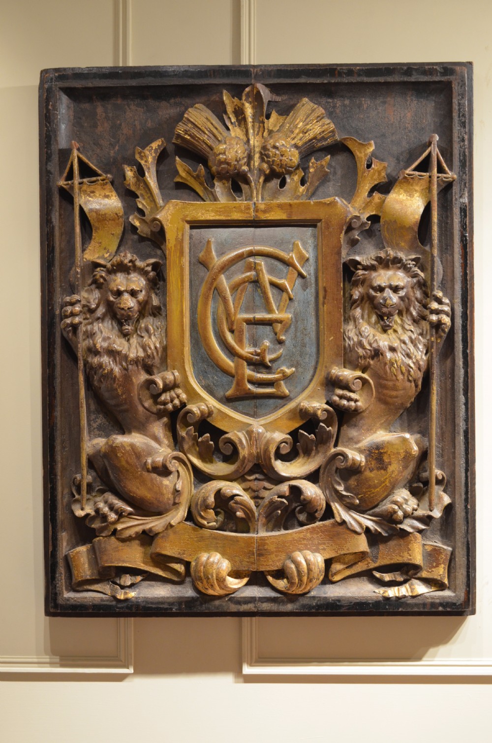 Decorative Early 18th Century Carved and Polychromed Armorial Plaque.