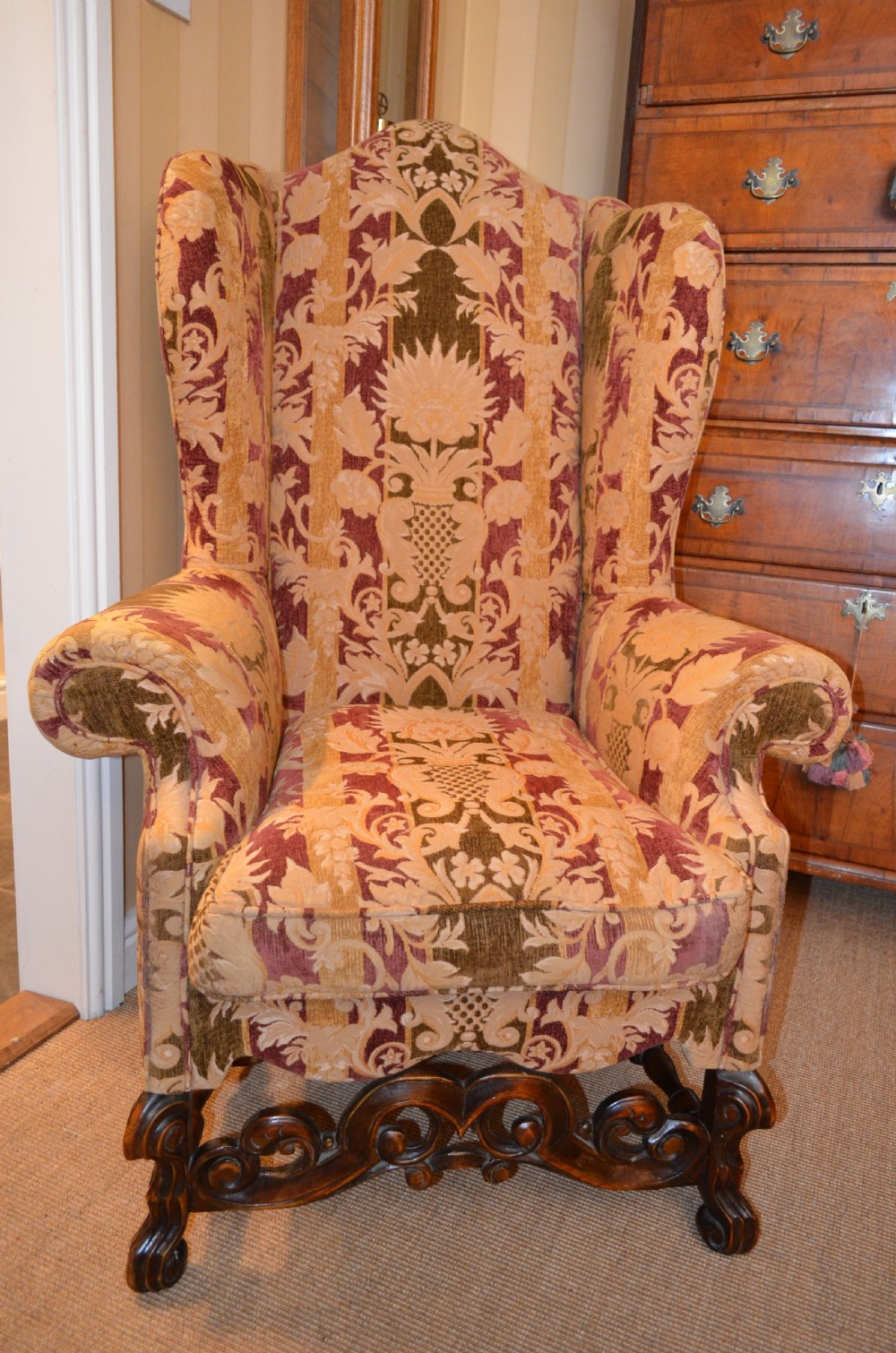 Fabulous Late 19th Century Wing Armchair with decorative carved stretchers C1890