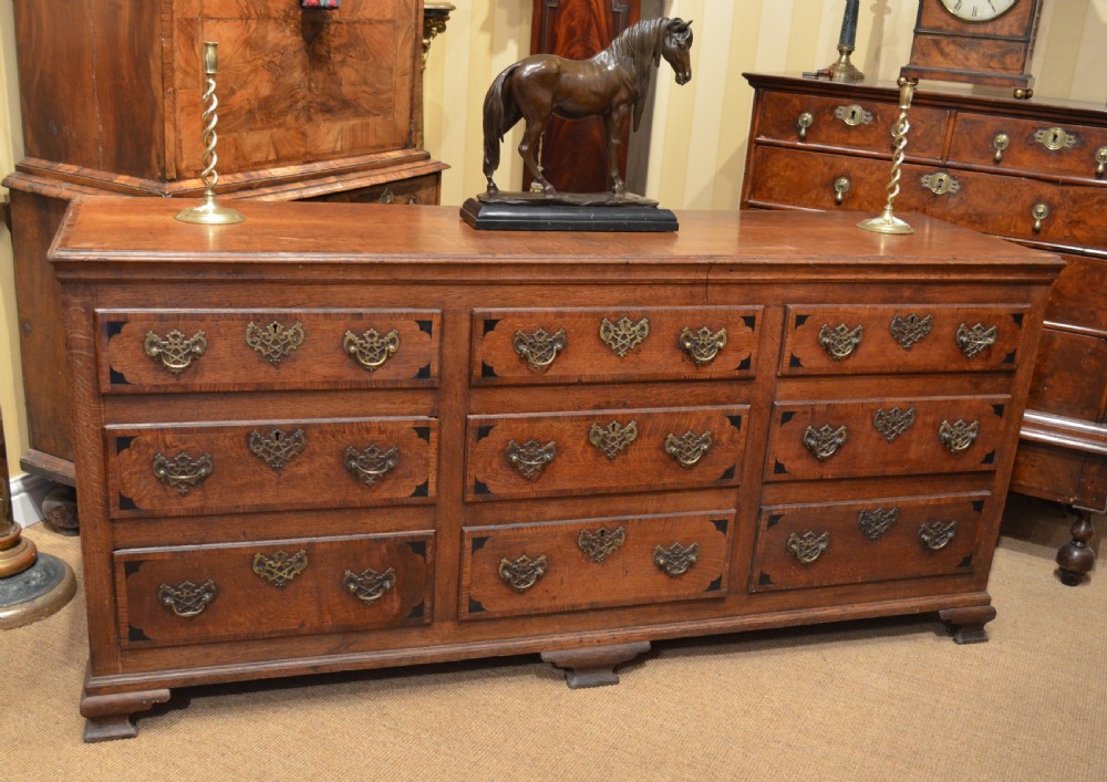 A Very Impressive Oak Dresser Base with nine drawers.