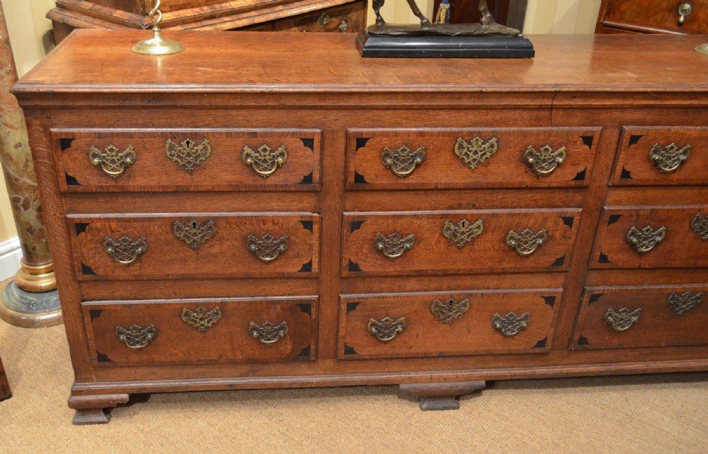 A Very Impressive Oak Dresser Base with nine drawers. View II