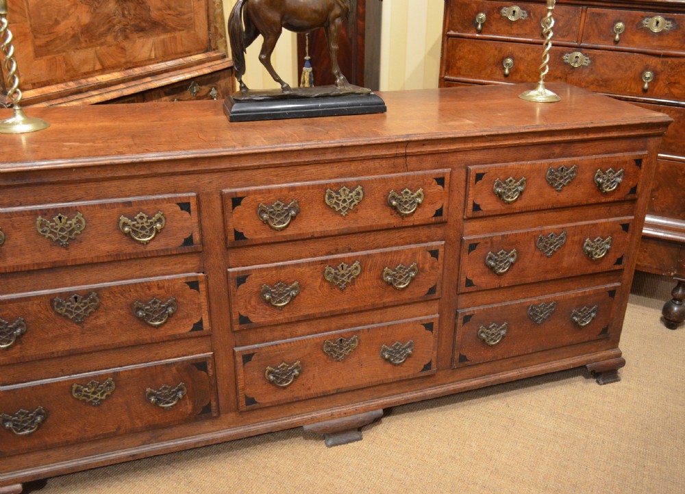 A Very Impressive Oak Dresser Base with nine drawers. View III