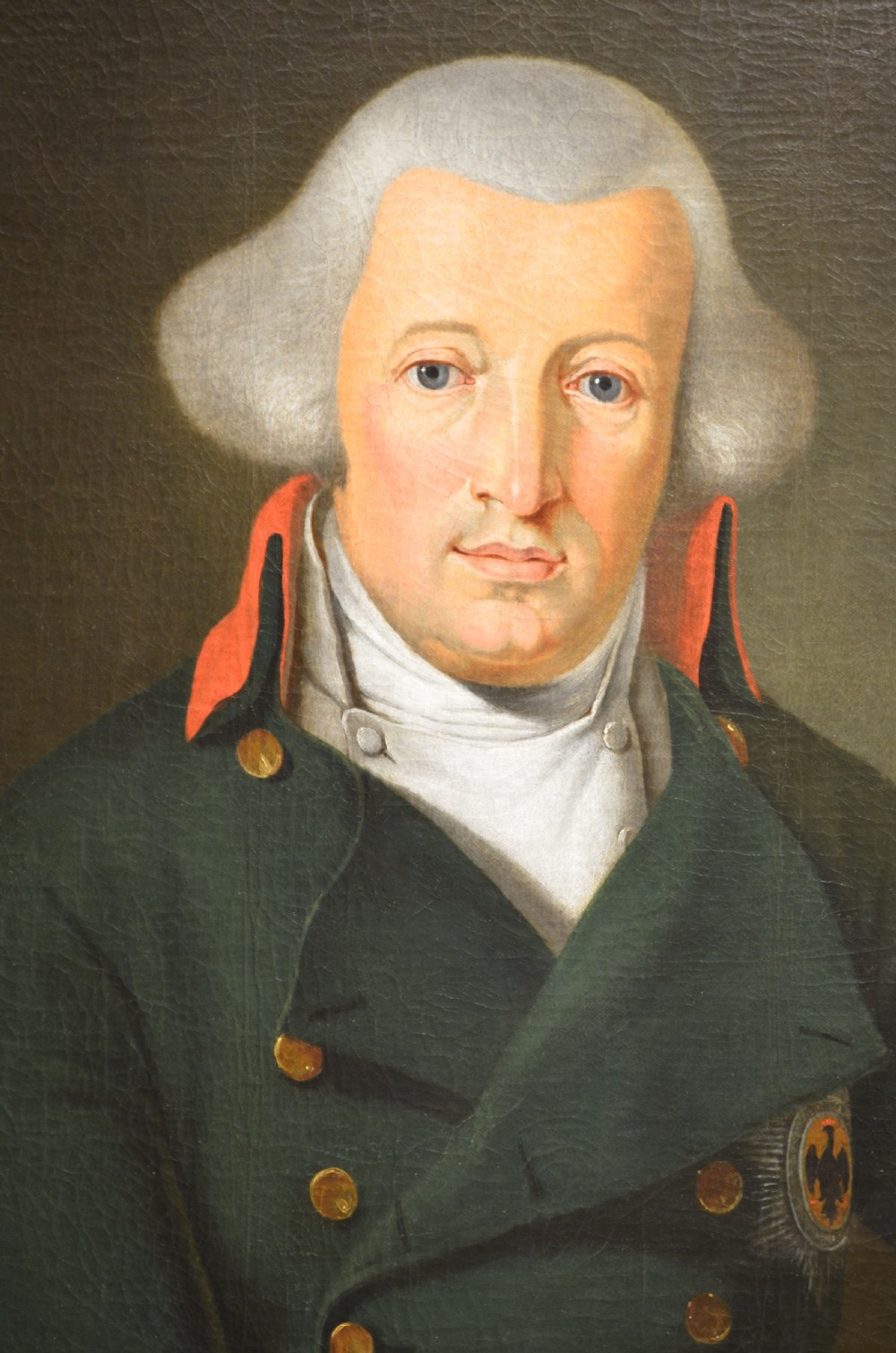 An antique oil painting depicting a Russian military officer in a dark uniform jacket set within an ornate gilded frame. View III