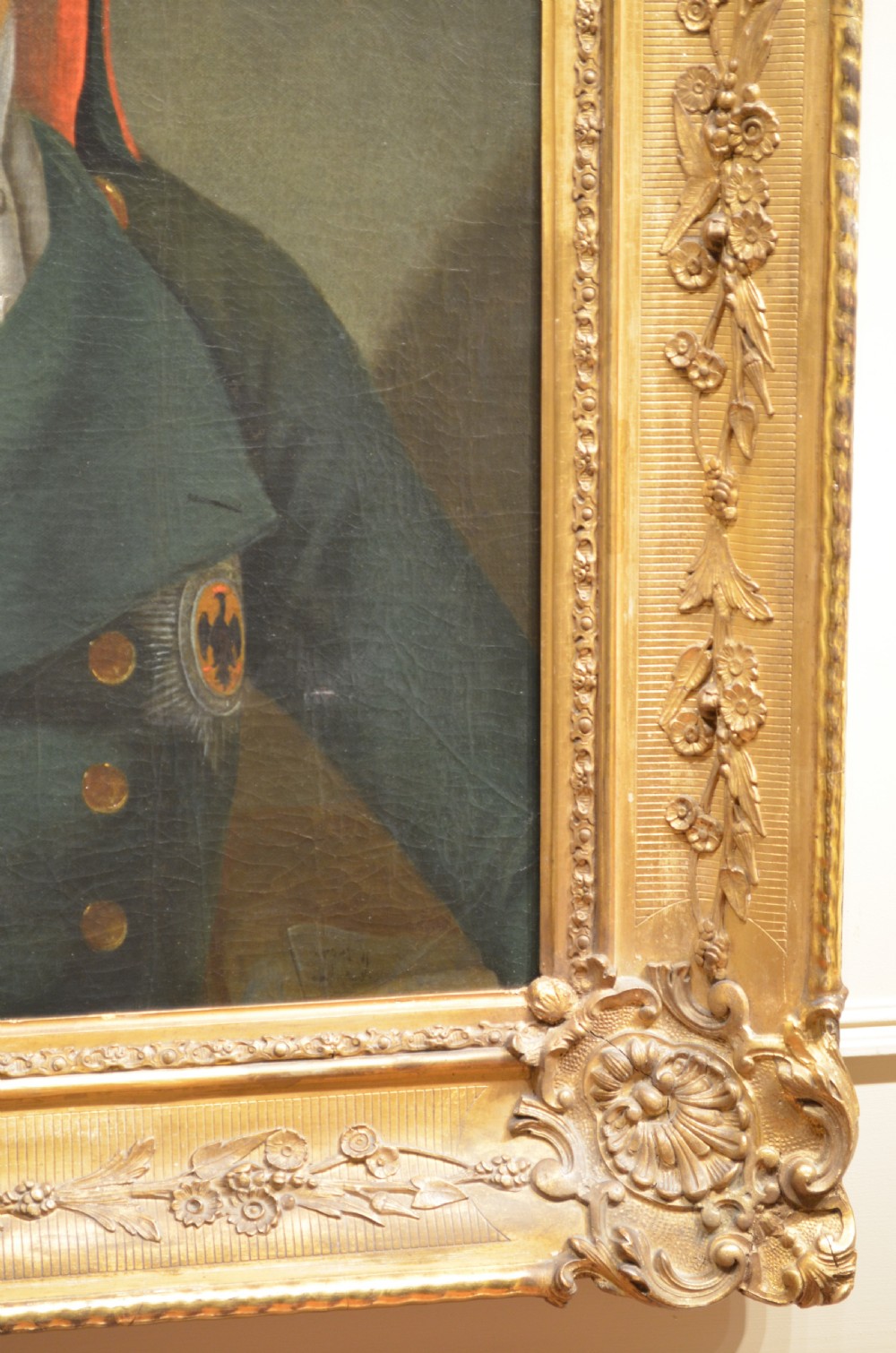 An antique oil painting depicting a Russian military officer in a dark uniform jacket set within an ornate gilded frame. View IV