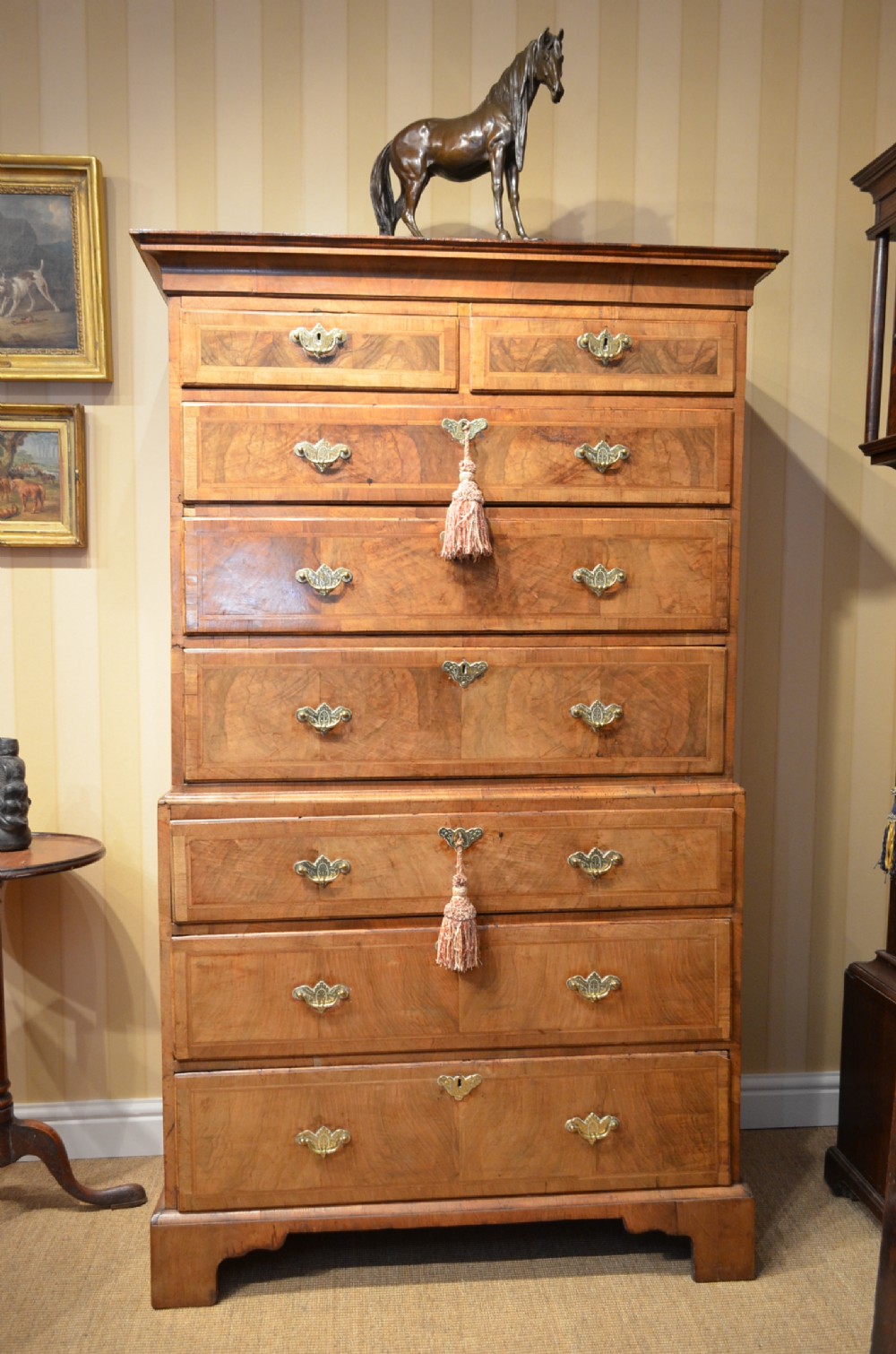 A GEORGE II WALNUT AND FEATHER BANDED CHEST ON CHEST