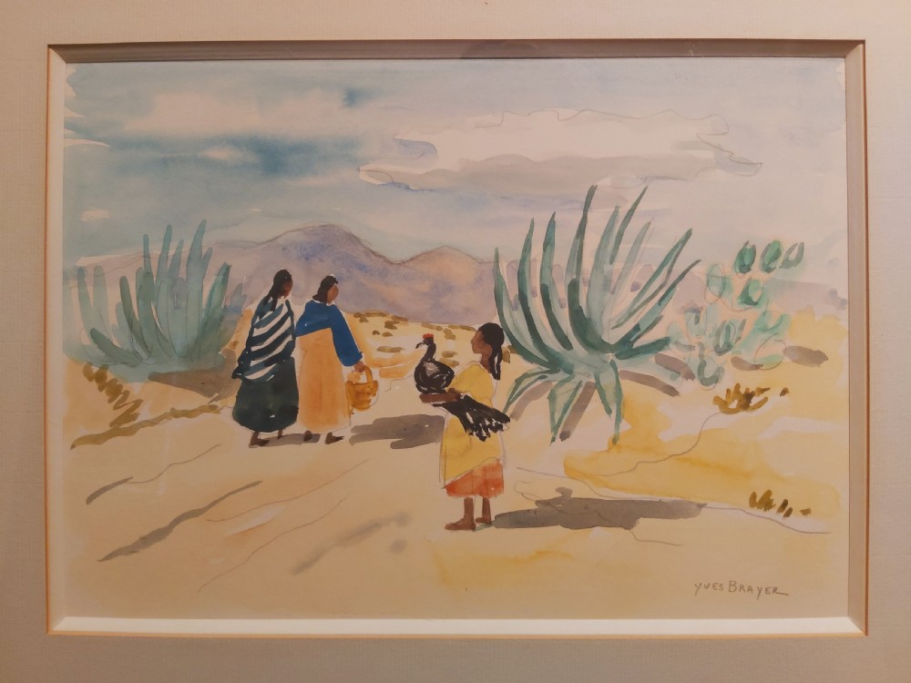 A framed watercolour painting depicting figures walking past agave plants in a desert landscape, presented in a gold-finished wooden frame with a cream mount. View VIII