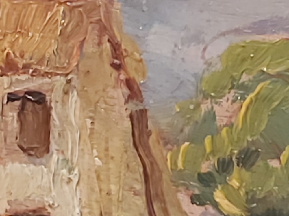 A framed impressionist landscape oil painting depicting a rural church, surrounding village buildings, lavender fields, and a dirt path. View V