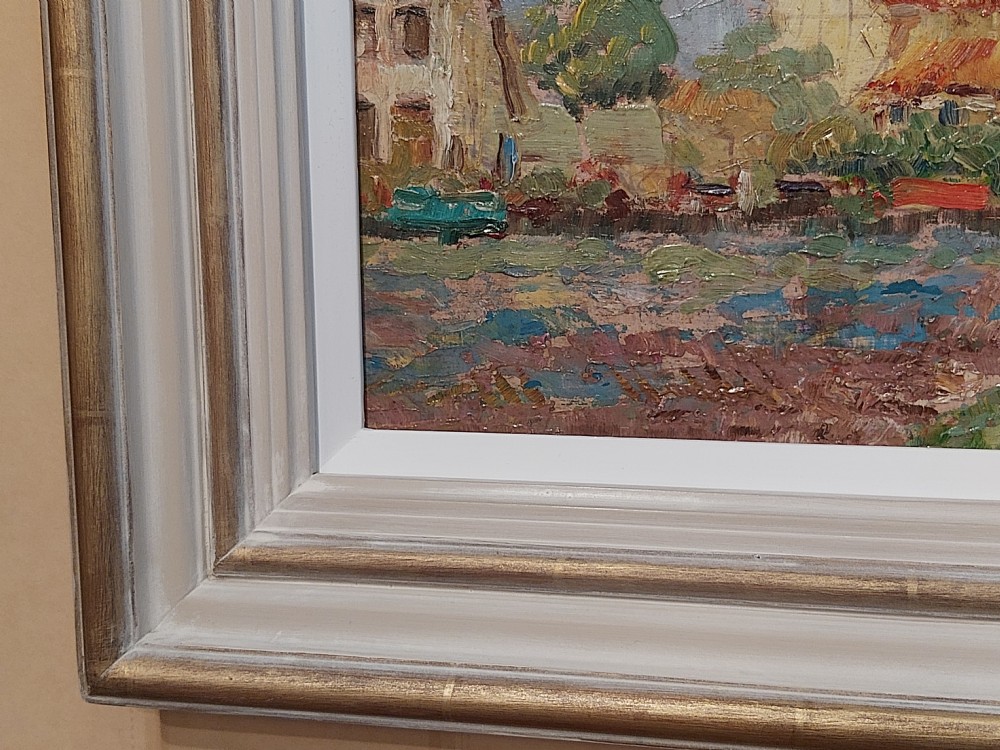 A framed impressionist landscape oil painting depicting a rural church, surrounding village buildings, lavender fields, and a dirt path. View XI