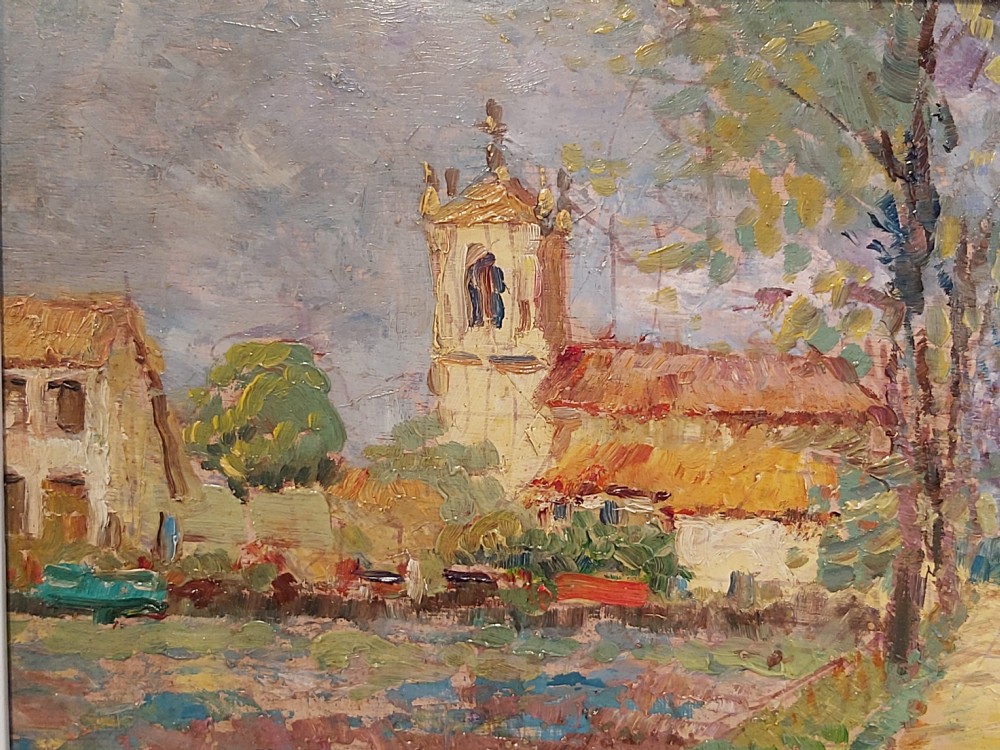 A framed impressionist landscape oil painting depicting a rural church, surrounding village buildings, lavender fields, and a dirt path. View XII