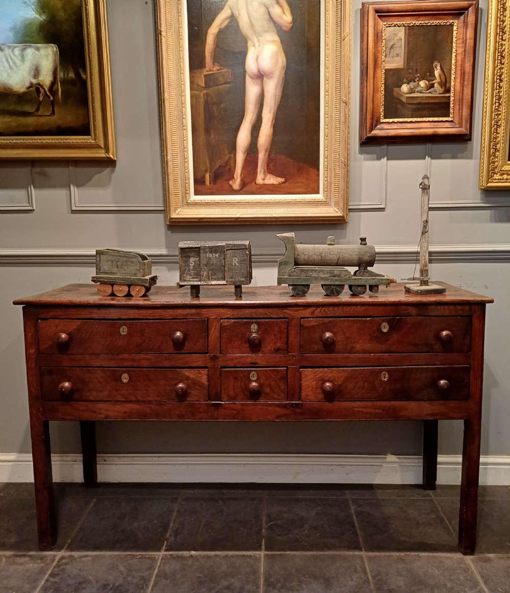 18TH CENTURY 6 DRAWER OAK AND ELM DRESSER BASE.