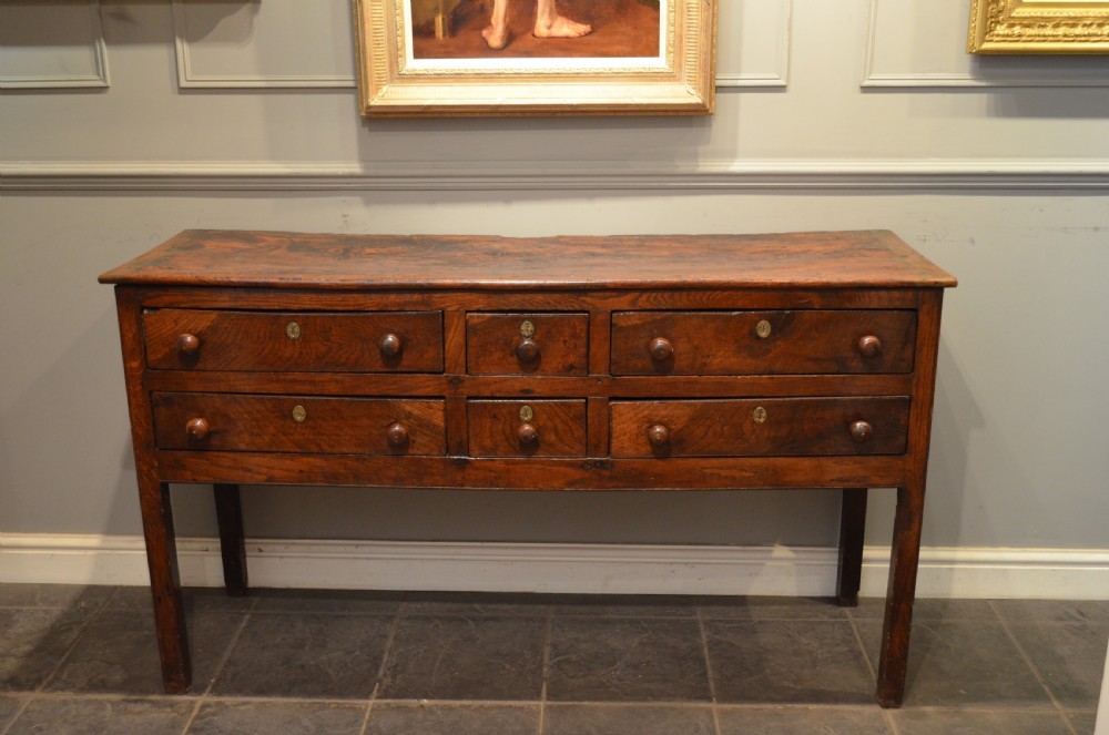 18TH CENTURY 6 DRAWER OAK AND ELM DRESSER BASE. View XVIII