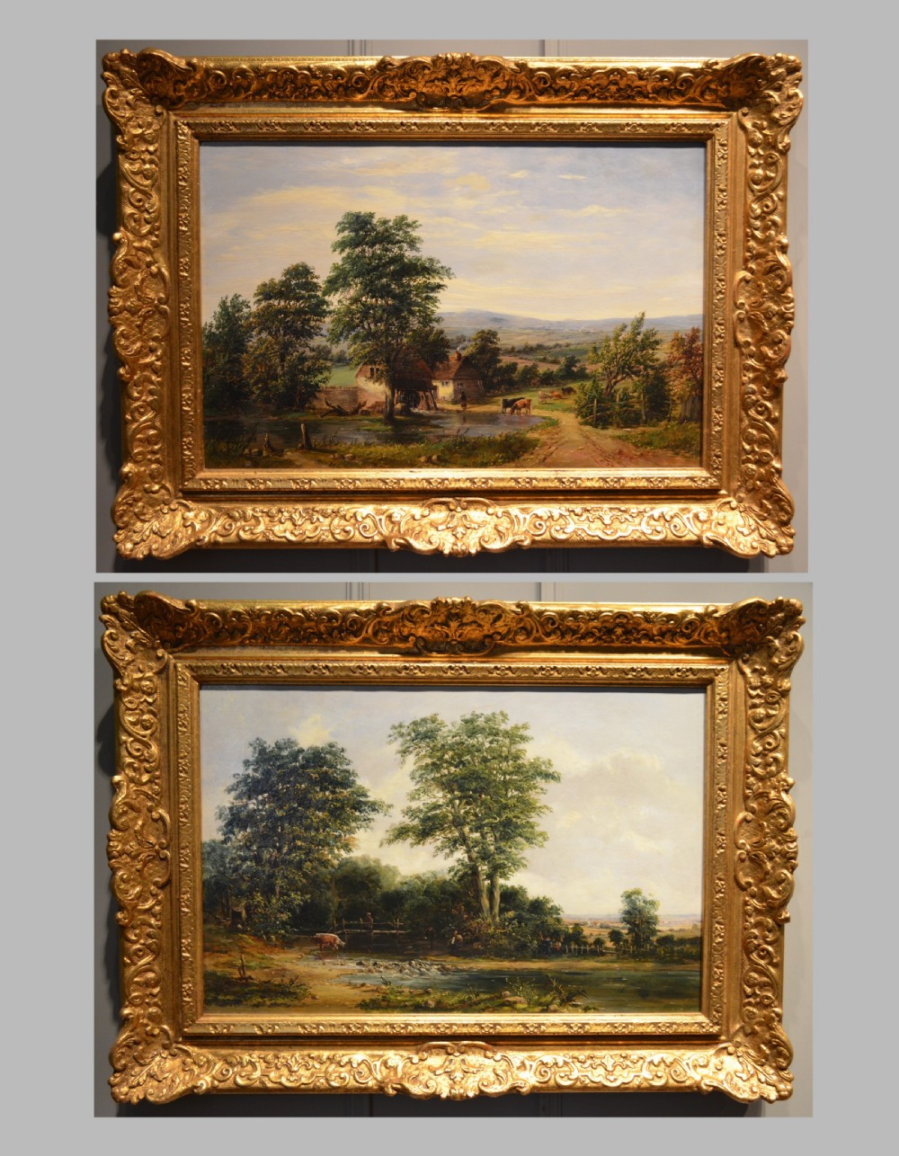 A pair of 19th-century oil paintings on canvas depicting peaceful English rural landscapes framed in elaborate gold giltwood frames.