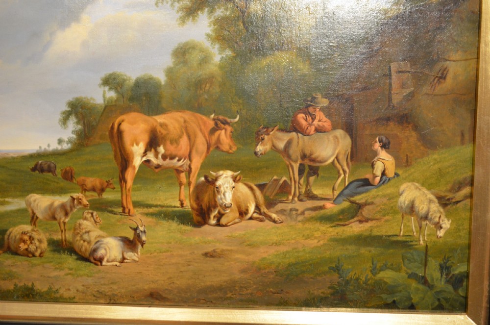 An antique framed Dutch pastoral oil painting depicting cattle, sheep, goats, a donkey, and figures in an open landscape under a cloud-filled sky. View III
