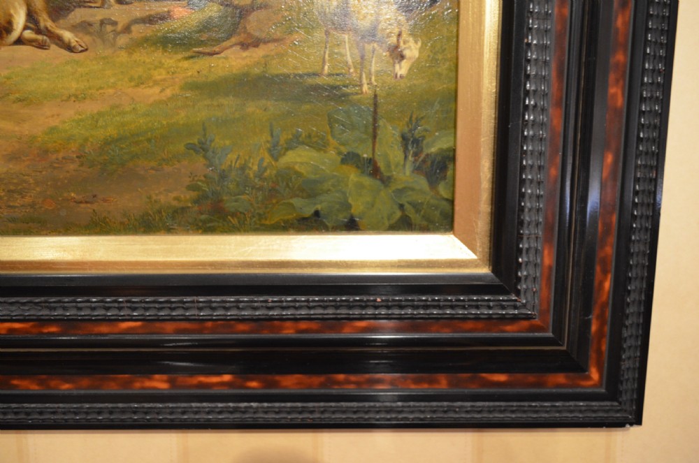 An antique framed Dutch pastoral oil painting depicting cattle, sheep, goats, a donkey, and figures in an open landscape under a cloud-filled sky. View V
