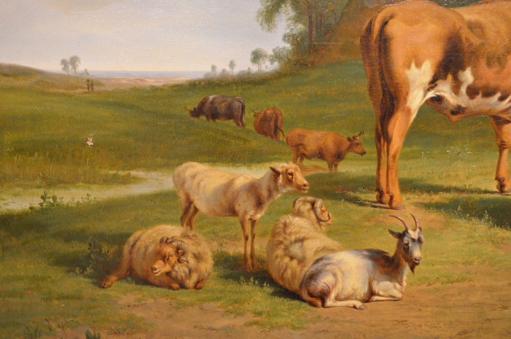 An antique framed Dutch pastoral oil painting depicting cattle, sheep, goats, a donkey, and figures in an open landscape under a cloud-filled sky. View IX