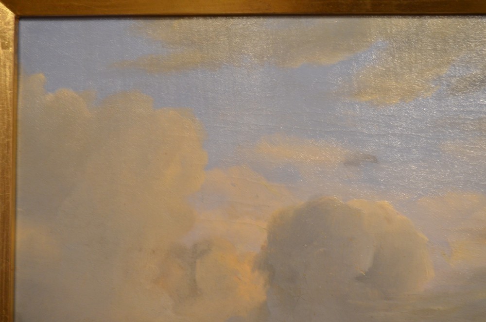 An antique framed Dutch pastoral oil painting depicting cattle, sheep, goats, a donkey, and figures in an open landscape under a cloud-filled sky. View XI