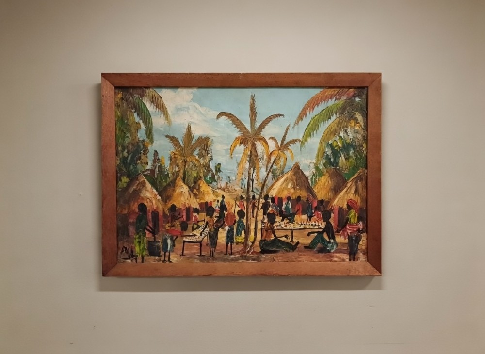 Oil on canvas of an African Village Scene - indistinctly signed DMA