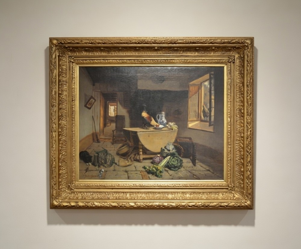 A 19th-century framed oil painting depicting a rustic cottage interior with a cockerel on a wooden table, vegetables on flagstone flooring, and light streaming through an open window.