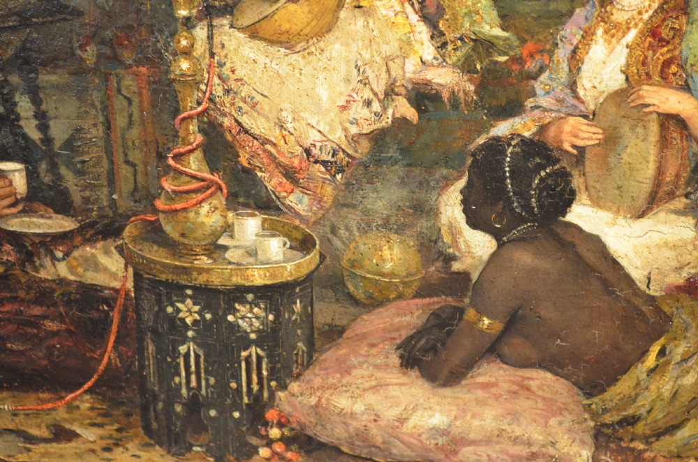 A framed 19th-century Orientalist oil painting on board featuring figures playing music and resting in a detailed interior scene. View IV